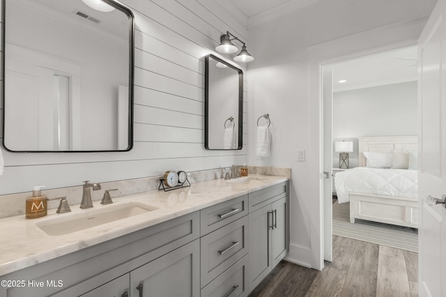 bathroom with crown molding and vanity