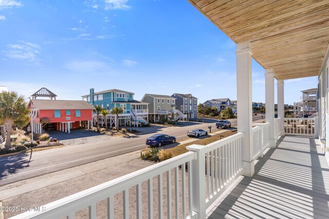 1012 Ocean Blvd W, Holden Beach, NC 28462 - balcony featuring covered porch and a residential view