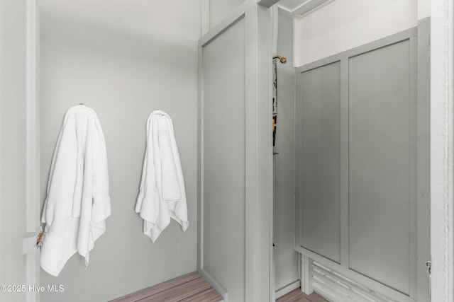 bathroom with hardwood / wood-style flooring