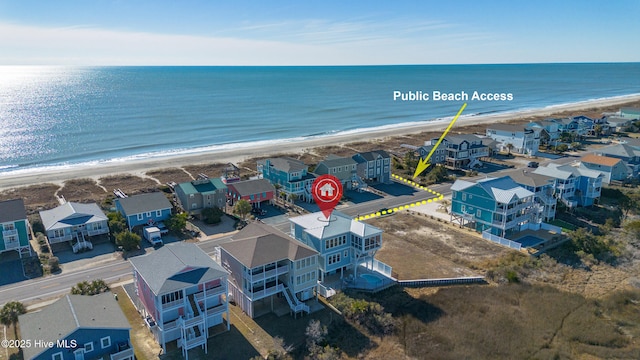 aerial view featuring a water view and a view of the beach