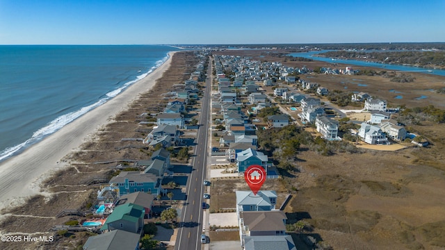 bird's eye view with a water view and a view of the beach