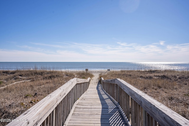 view of home's community featuring a view of the beach and a water view