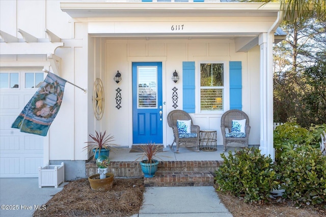 entrance to property featuring covered porch