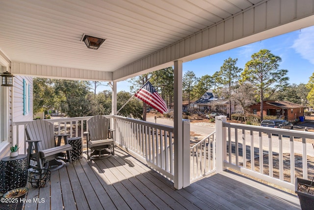 wooden terrace with a porch