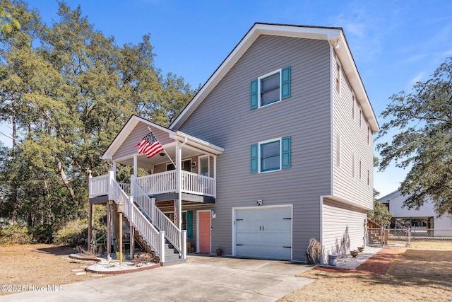 view of front of property featuring a porch and a garage