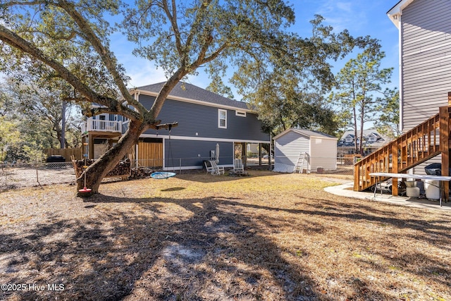 rear view of property with a shed