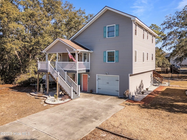 view of front property featuring a porch and a garage