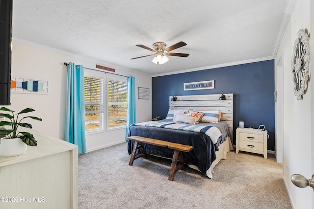 bedroom featuring crown molding, ceiling fan, light carpet, and a textured ceiling