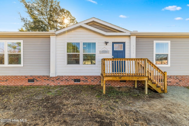 back of house featuring a deck