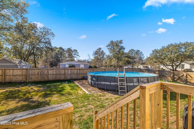 view of yard with a fenced in pool