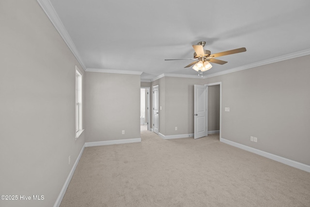 unfurnished room featuring light colored carpet, ceiling fan, and ornamental molding