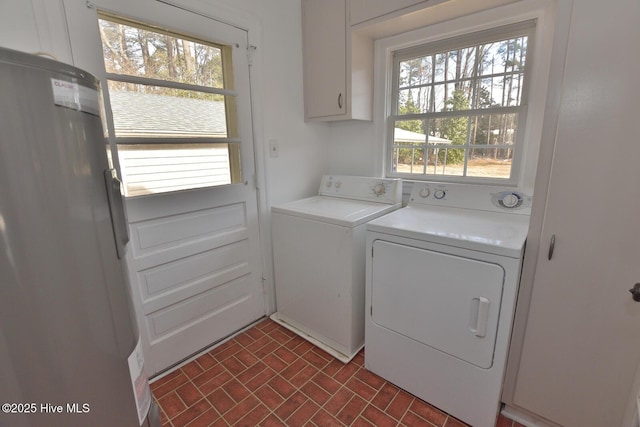 laundry room with cabinets and washing machine and dryer