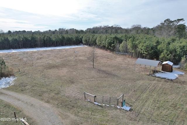 birds eye view of property with a water view and a rural view