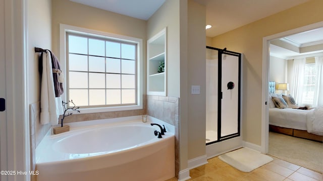 bathroom featuring ornamental molding, separate shower and tub, and tile patterned flooring