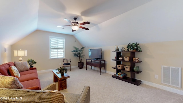 living room with ceiling fan, light colored carpet, and vaulted ceiling