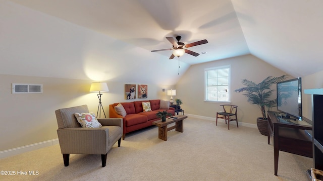 living room with vaulted ceiling, ceiling fan, and light carpet