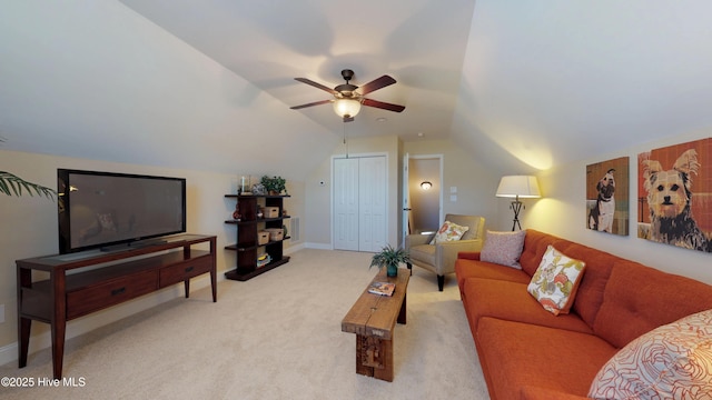 living room featuring ceiling fan, light colored carpet, and lofted ceiling