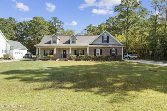 view of front facade with a garage, a front lawn, and a porch