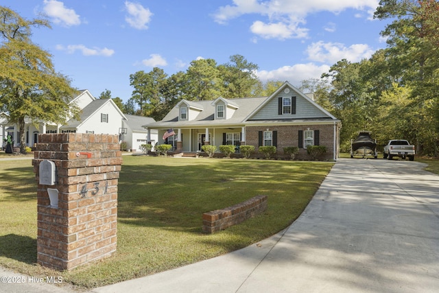 view of front of house with covered porch and a front lawn