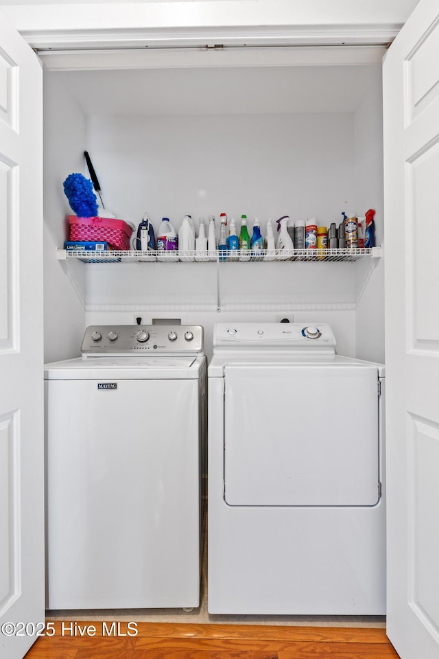 laundry area with washing machine and clothes dryer