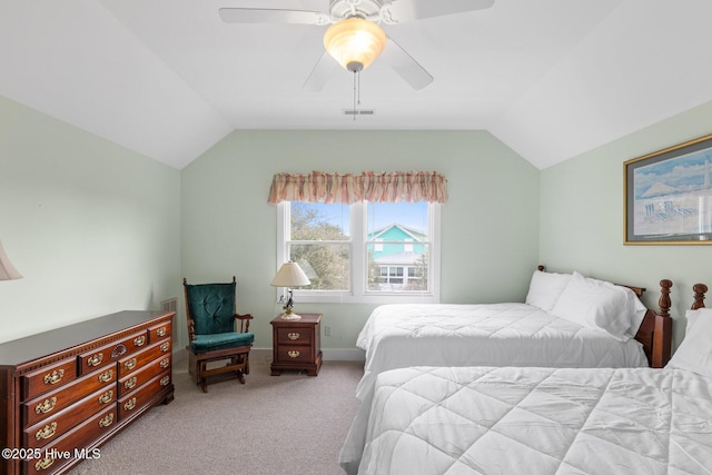 bedroom with vaulted ceiling, light colored carpet, and ceiling fan