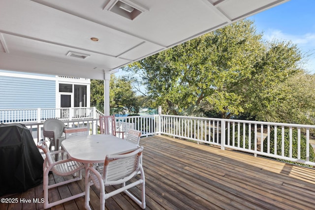 wooden deck with area for grilling