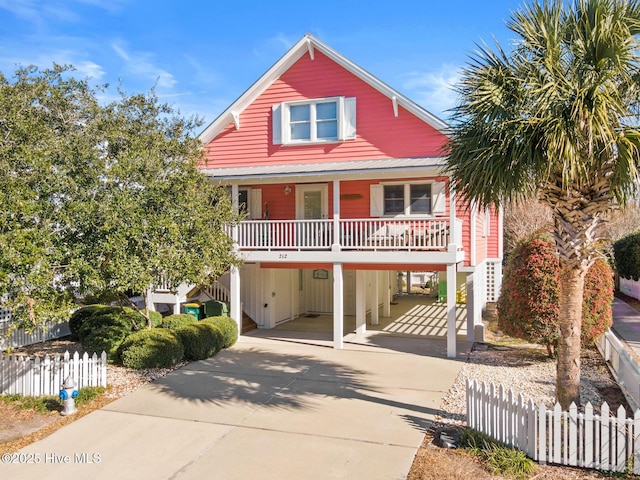 view of front of home with a carport and covered porch