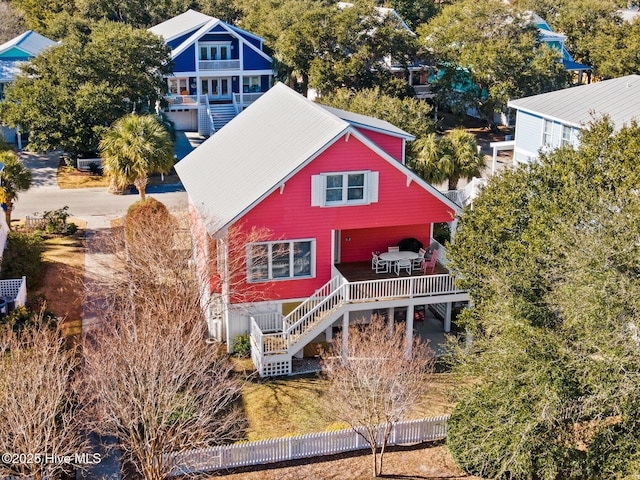 rear view of house featuring a deck