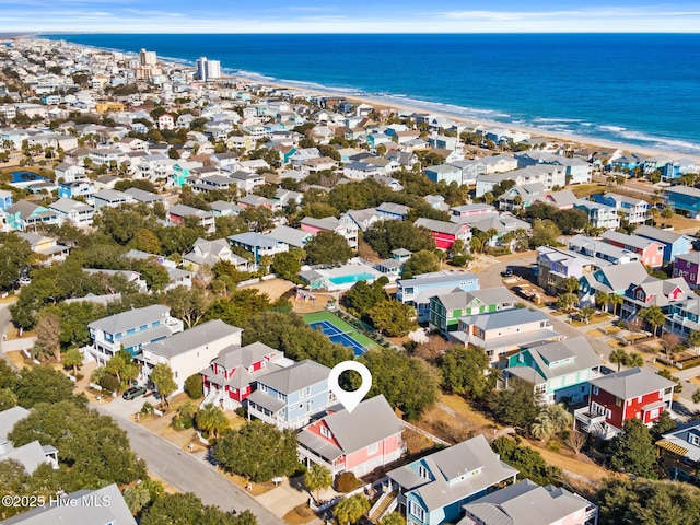 birds eye view of property featuring a beach view and a water view