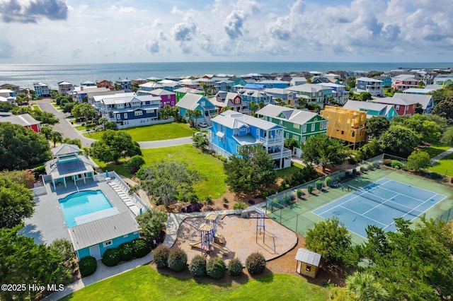 birds eye view of property with a water view