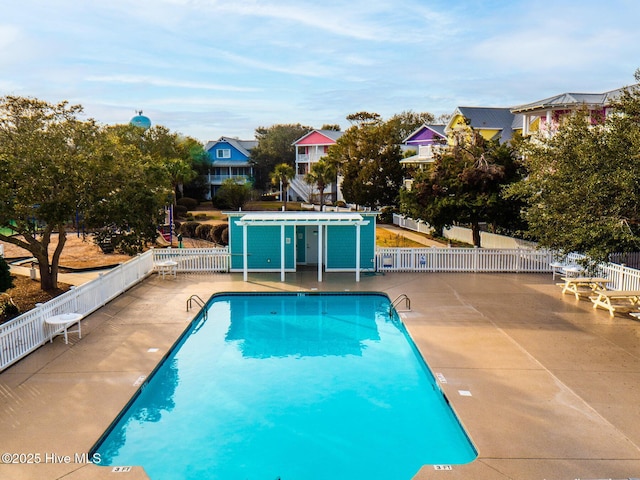 view of swimming pool with a patio