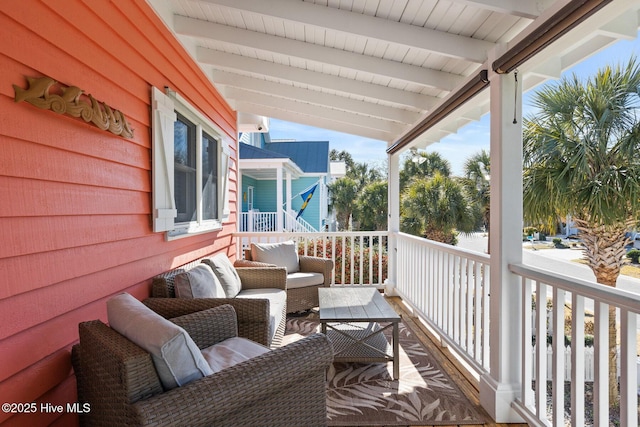 balcony featuring outdoor lounge area and covered porch