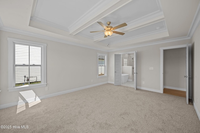 unfurnished bedroom with multiple windows, connected bathroom, ceiling fan, and ornamental molding