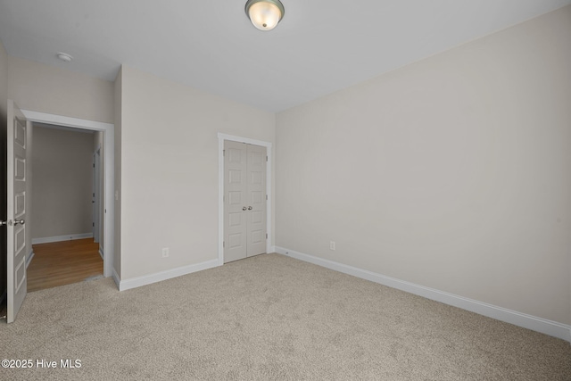 unfurnished bedroom featuring light colored carpet