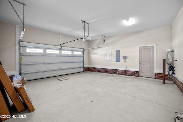 garage with a garage door opener, electric panel, and water heater