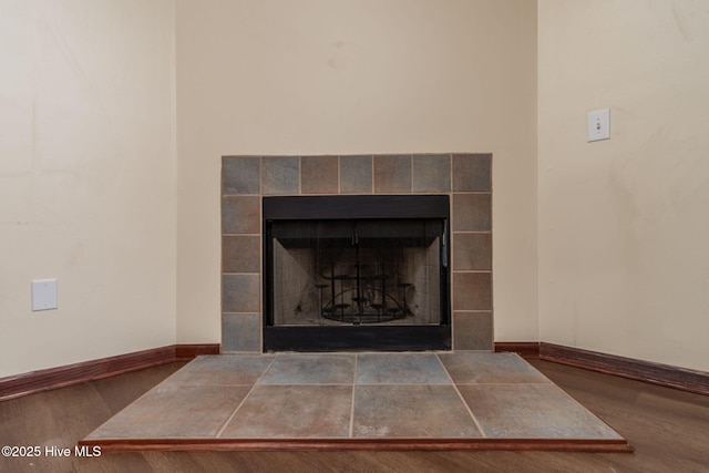 details with wood-type flooring and a fireplace