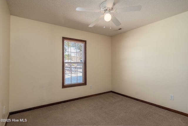 unfurnished room with light carpet, a textured ceiling, and ceiling fan