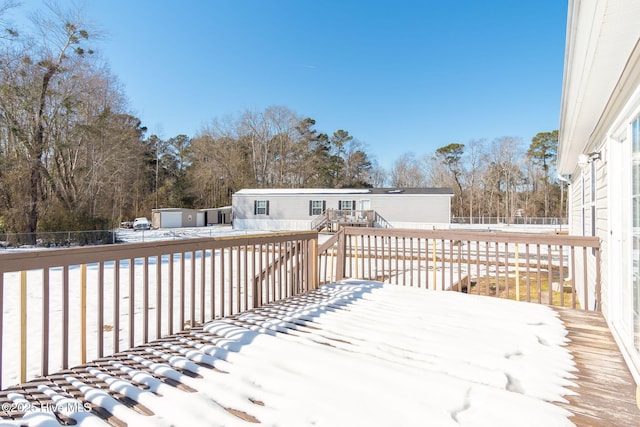 view of snow covered deck