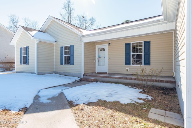 single story home with covered porch