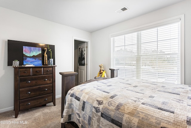 bedroom featuring light colored carpet