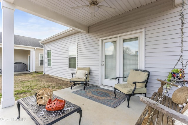 view of patio featuring ceiling fan