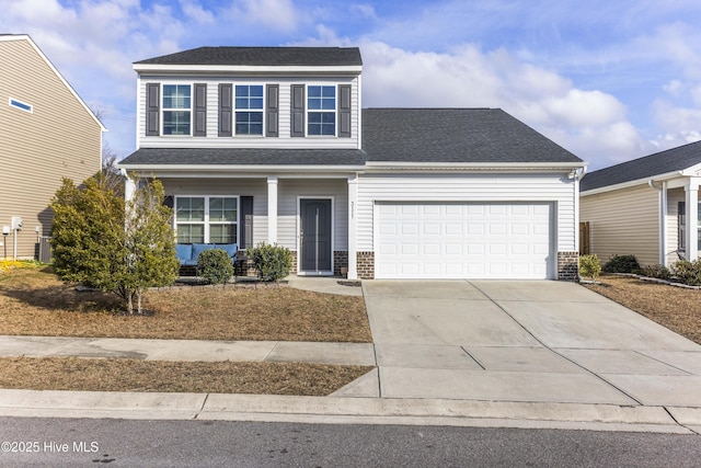 front of property featuring a garage and a porch