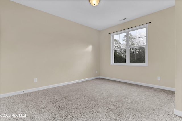 empty room featuring carpet flooring