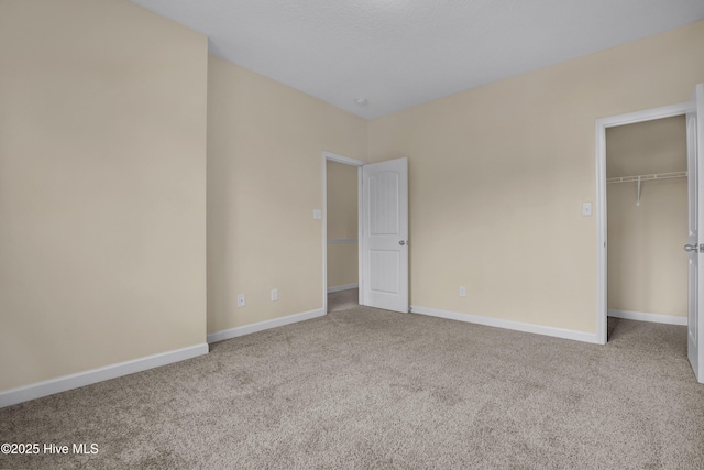 unfurnished bedroom featuring light carpet