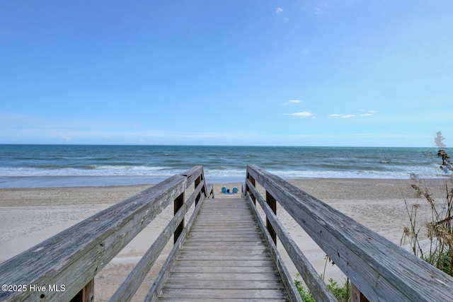 view of home's community featuring a view of the beach and a water view