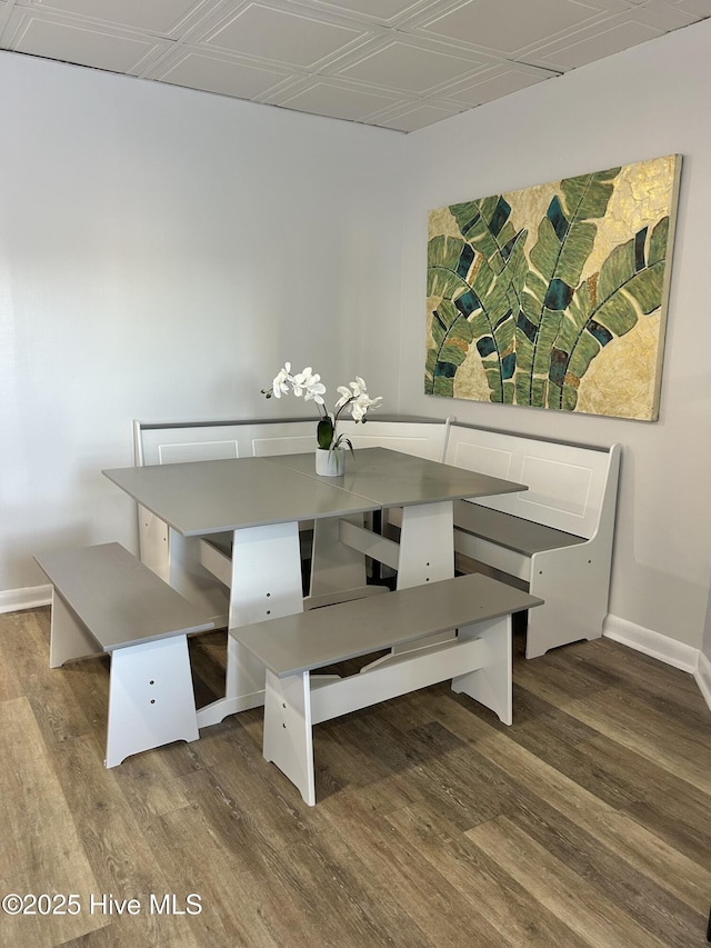 unfurnished dining area featuring wood-type flooring