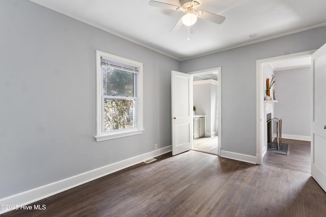 unfurnished bedroom with dark hardwood / wood-style flooring, crown molding, and ensuite bathroom