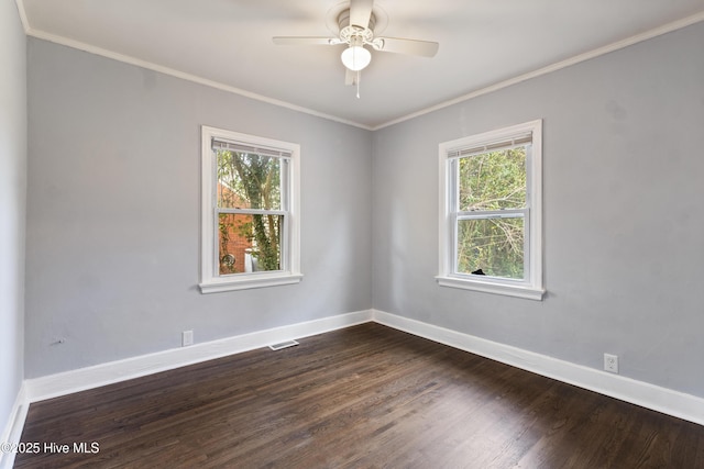 unfurnished room with crown molding, dark wood-type flooring, and ceiling fan