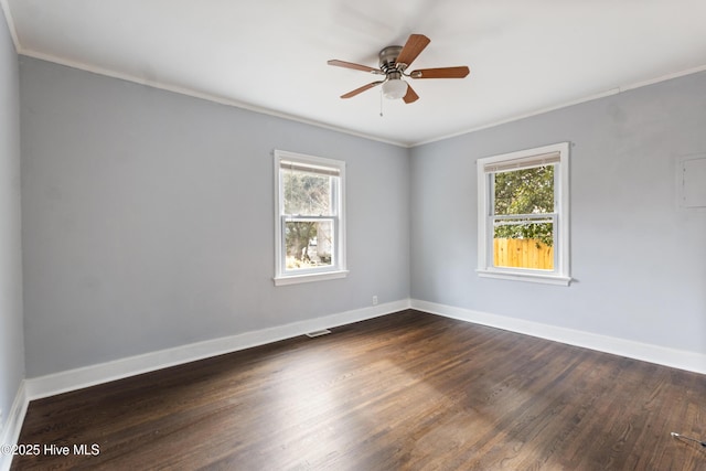 spare room featuring ornamental molding, dark hardwood / wood-style floors, and ceiling fan