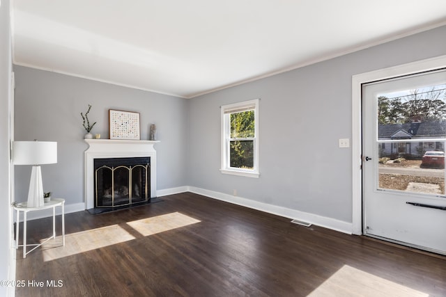 unfurnished living room with dark wood-type flooring